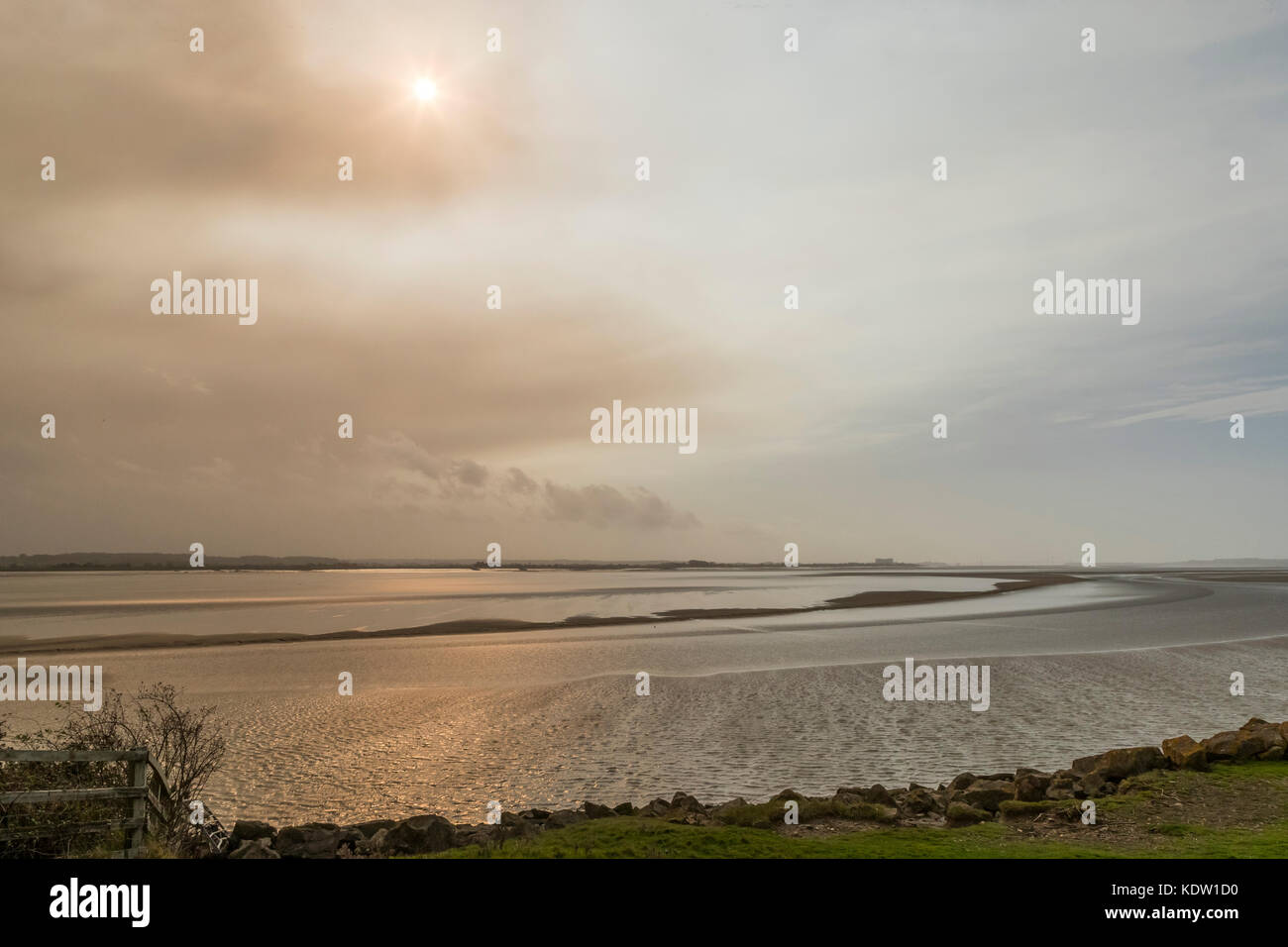 Lydney, Forest of Dean, Gloucestershire, UK. 16th October, 2017.  Mid day red sun, Severn estuary at Lydney, Forest of Dean, Gloucestershire. Credit: David Broadbent/Alamy Live News Stock Photo