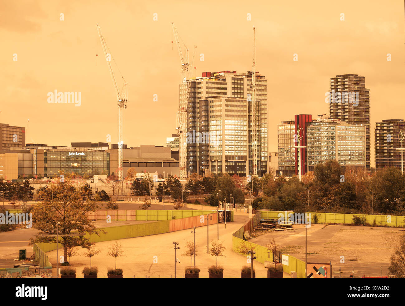 London ,UK, 16th October 2017. Buildings at the International Quarter, Westfield Stratford, lit up against the orange sky caused by Hurricane Ophelia. Credit: Katharine Rose/Alamy Live News Stock Photo
