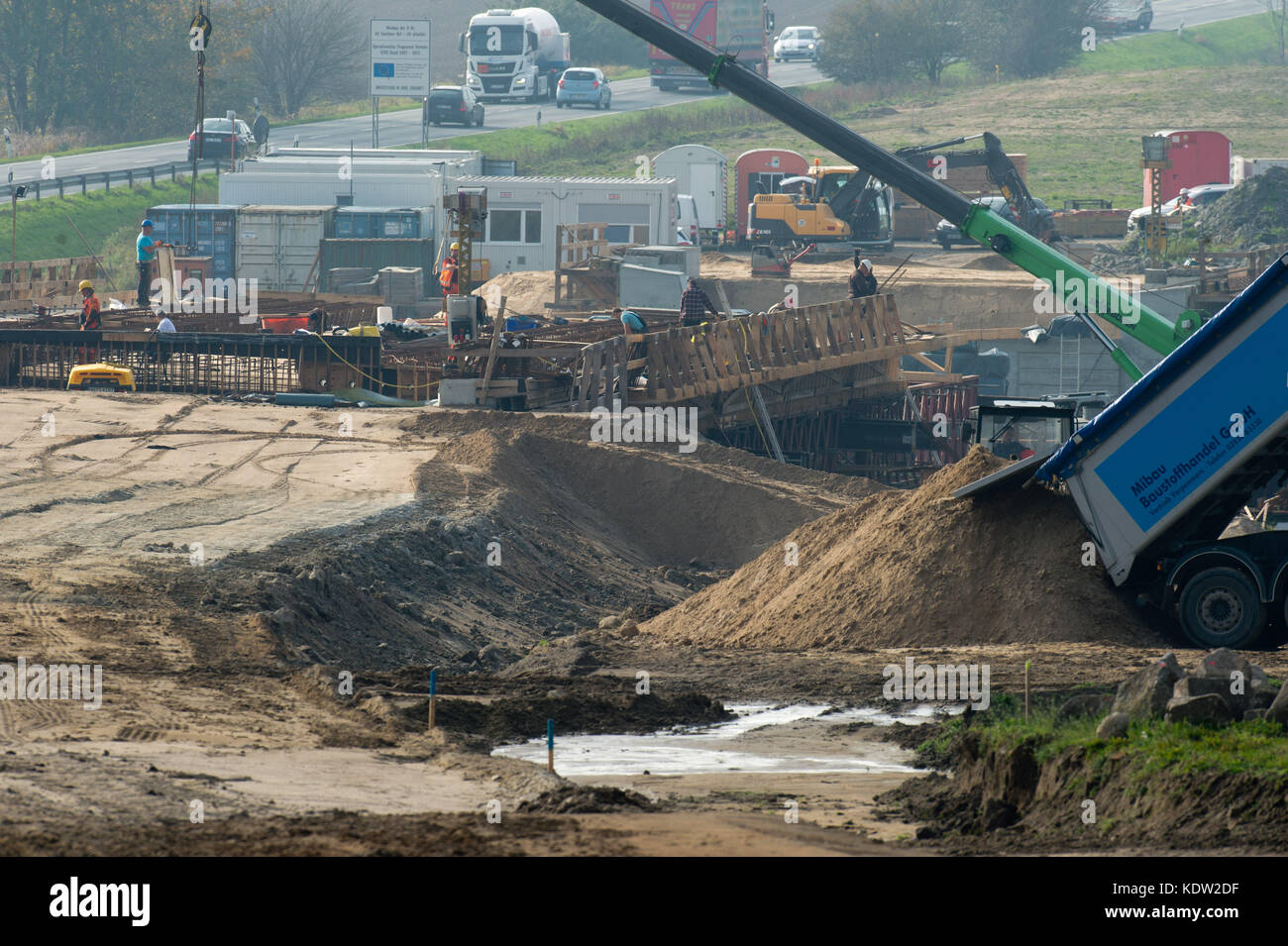 Construction machines are in operation during the foundation works of a new bridge across the Sehrowbach stream for the junction of the new federal highway B96 near Samtens, Germany, 16 October 2017. The section is ment to lead from Samtens to Bergen and thereby eliminate traffic bottlenecks. Moreover, it is ment to better connect the island to the transeuropean traffic network with the motorway A20. The construction began during summer 2016. Altogether around 55.6 million euros have been approved for the works. By June of 2019 the construction works are ment to be completed. Photo: Stefan Sau Stock Photo
