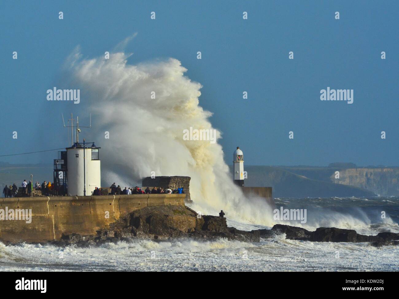 Porthcawl, Wales, UK. 16th October 2017. Ex-hurricane Ophelia whips up waves which break over sea defences on her way past Wales with high winds even in Porthcawl miles from the storm's centre in Ireland. Picture credit: Ian Homer/ Alamy Live News Stock Photo