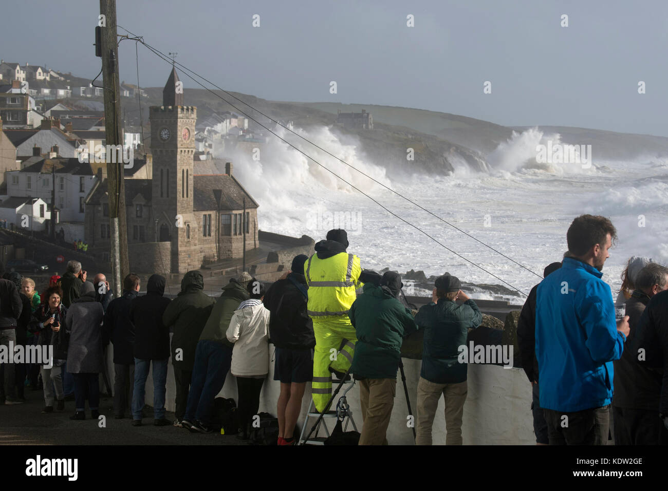 Porthleven, Cornwall. 16th October, 2017. Storm watchers gather at high tide in Porthleven during Hurricane Ophelia Credit: Bob Sharples/Alamy Live News Stock Photo