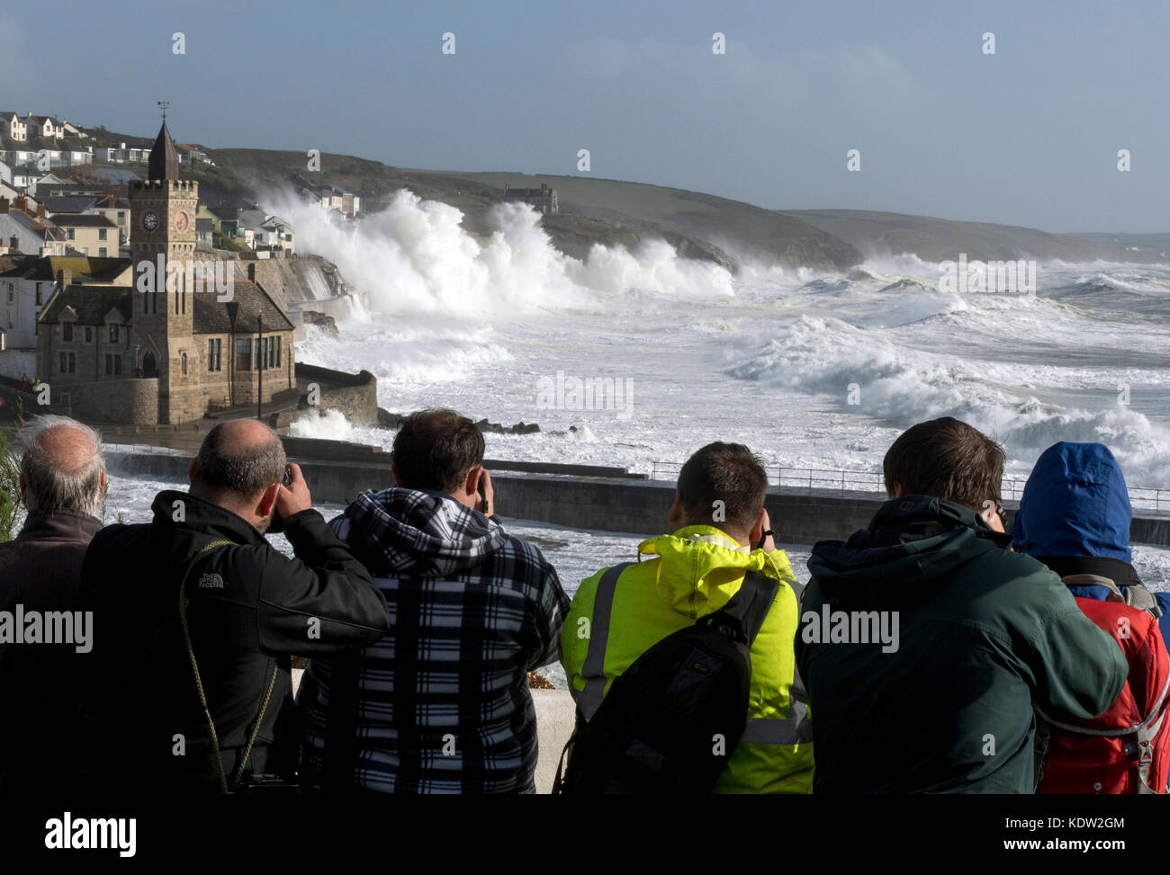 Porthleven, Cornwall. 16th October, 2017. Storm watchers gather at high tide in Porthleven during Hurricane Ophelia Credit: Bob Sharples/Alamy Live News Stock Photo
