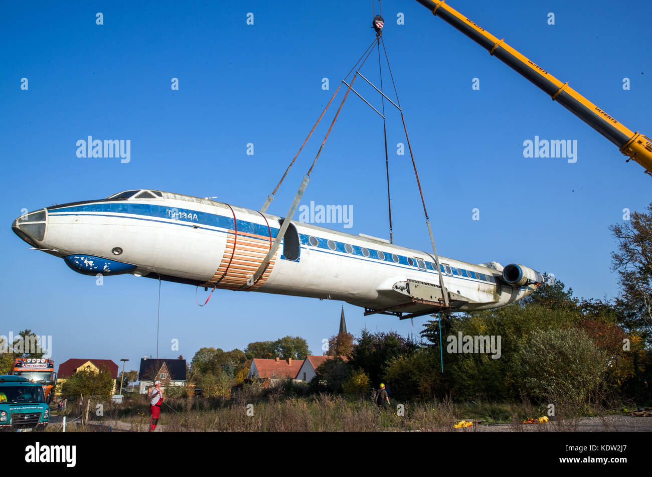 After months of preparation, airplane experts load the fuselage of a ...