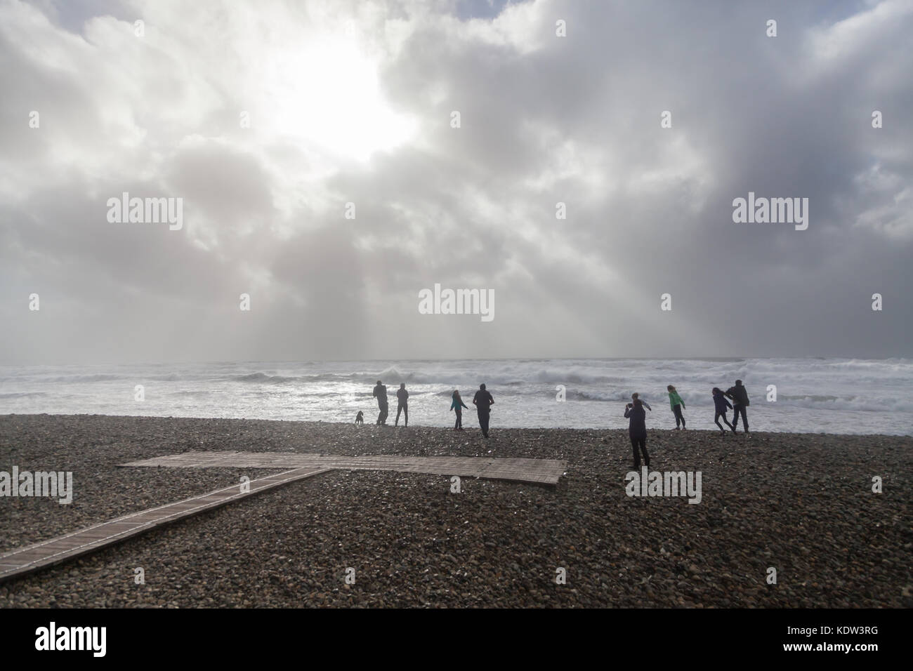 Newgale in Pembrokeshire, UK. 16th October, 2017. UK Weather: Remnants of Hurricane Ophelia hit Newgale in Pembrokeshire. People head to the coast to experience the high winds and rough seas at high tide. Credit: Derek Phillips/Alamy Live News Stock Photo