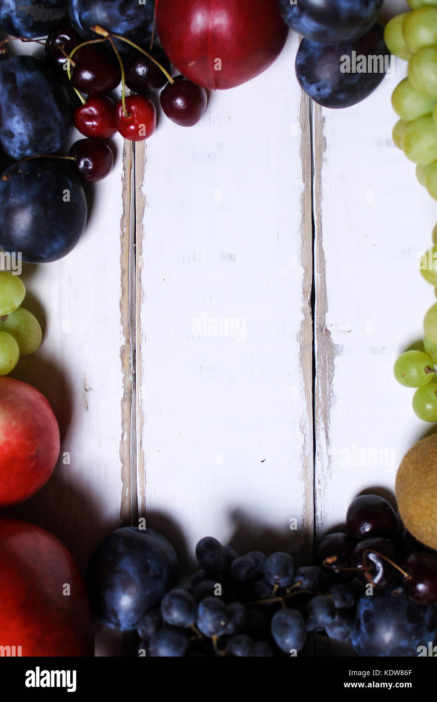 Fruits lying on the wooden table Stock Photo - Alamy