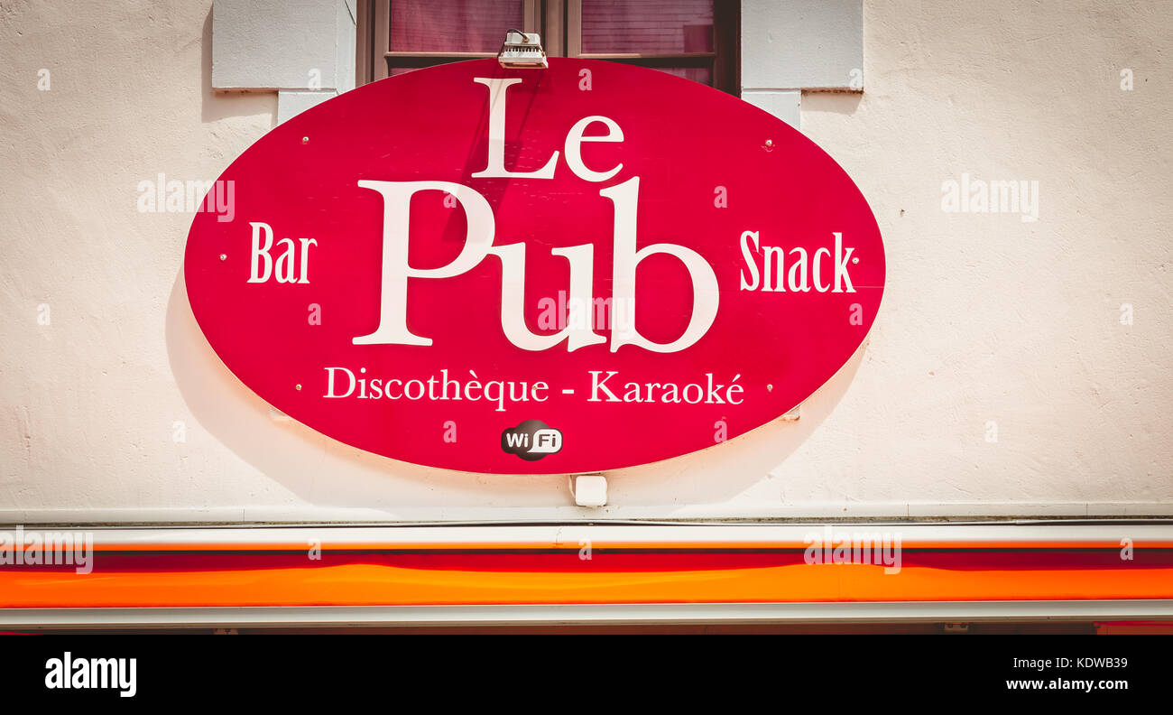 NOIRMOUTIER, FRANCE - July 03, 2017 : sign of a pub in the city center
