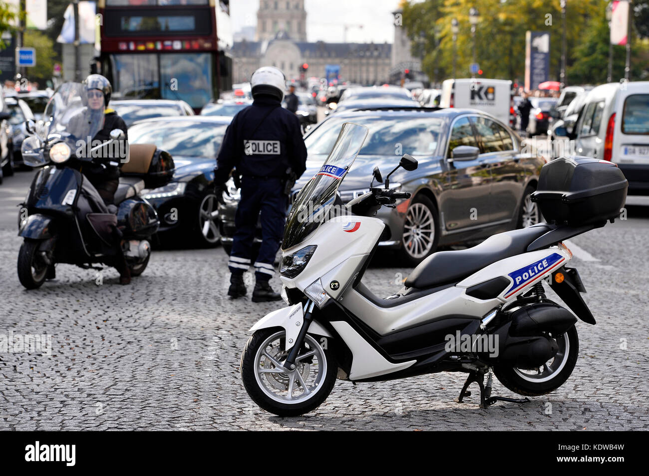 Police officer regulating traffic, Paris - France Stock Photo