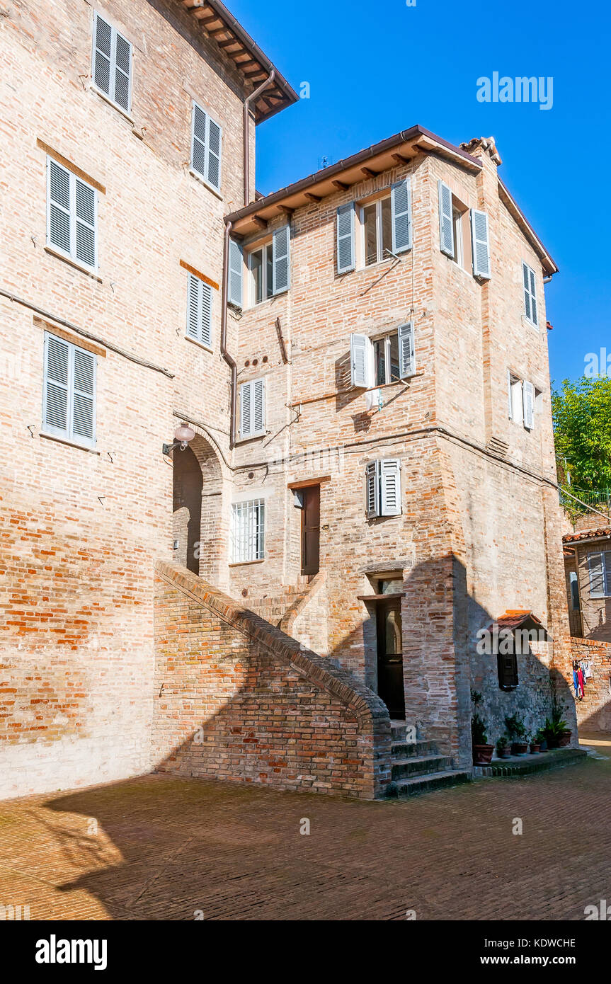 A summer view of a house in a street of the renaissance town of Urbino, Marche, Italy Stock Photo