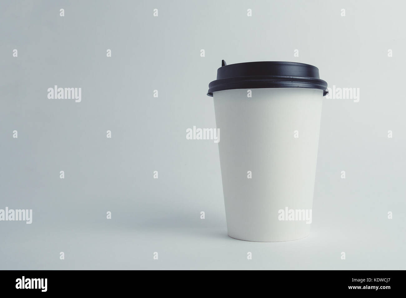 Paper cup with cap Stock Photo - Alamy