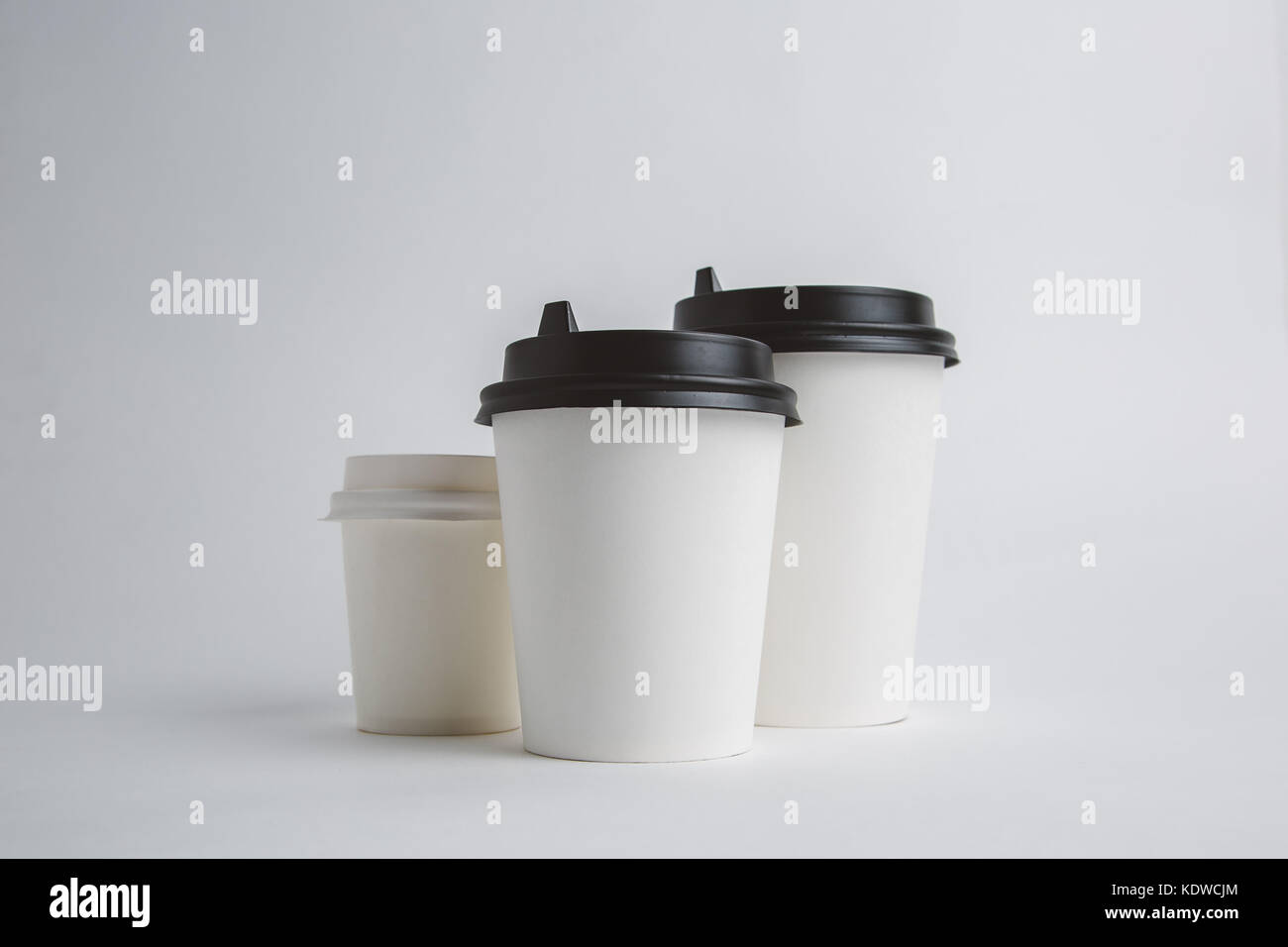 Paper cup with cap Stock Photo - Alamy