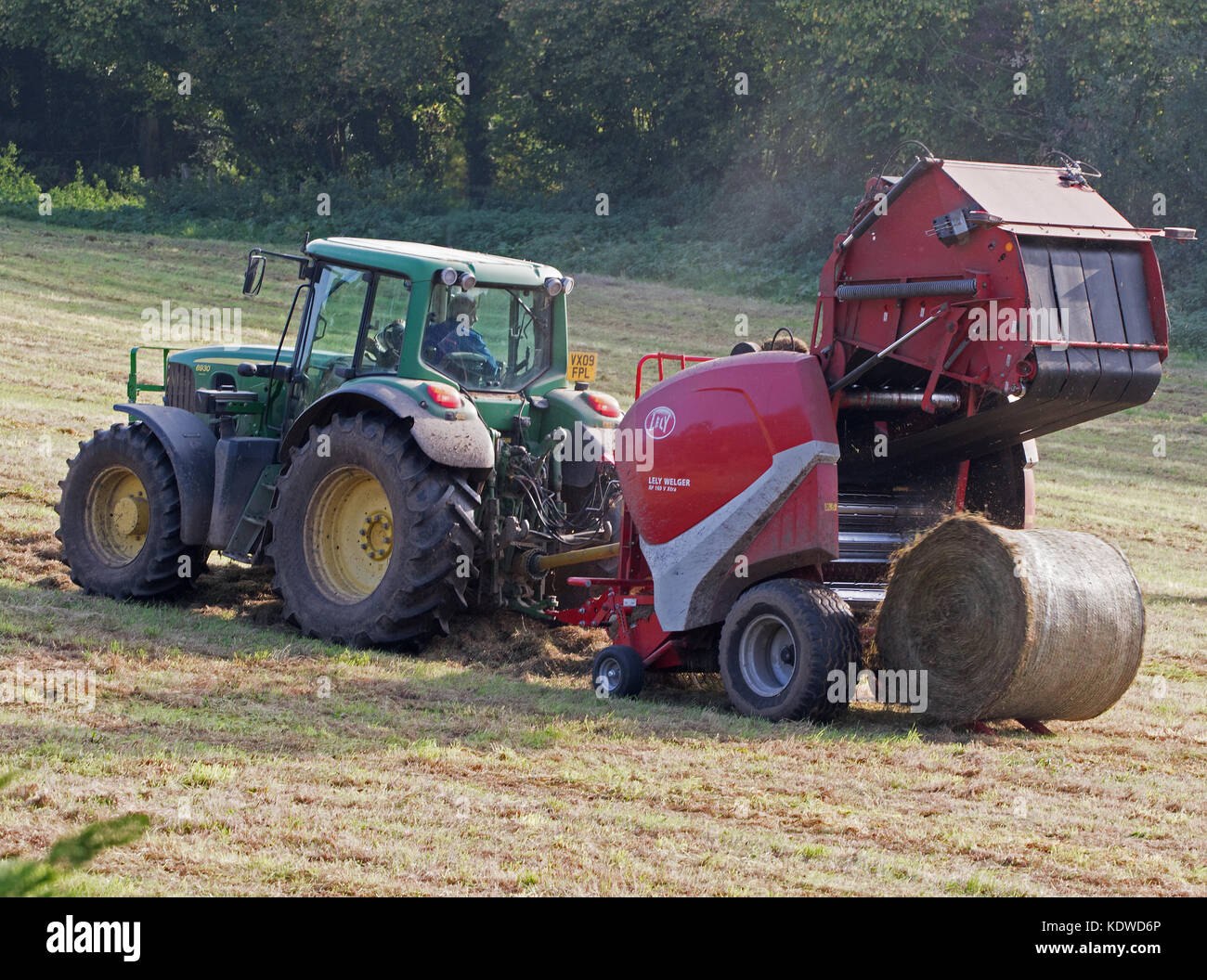 John Deere 6930 Tractor Baling hay with Lely Welger RP160 V Baler Stock  Photo - Alamy