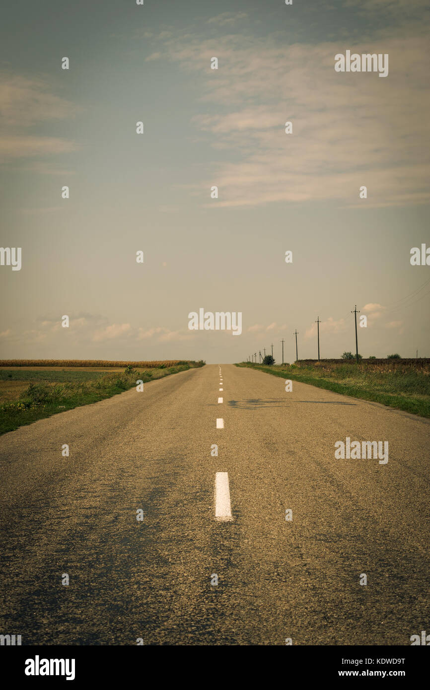 Country road in the fields Stock Photo - Alamy