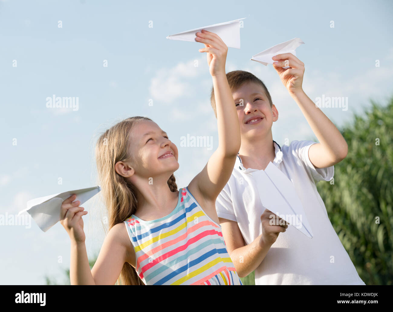 Boy girl playing paper planes hi-res stock photography and images - Alamy