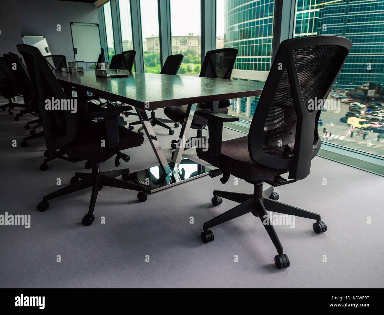 Empty conference room overlooking downtown district, shallow depth of field Stock Photo