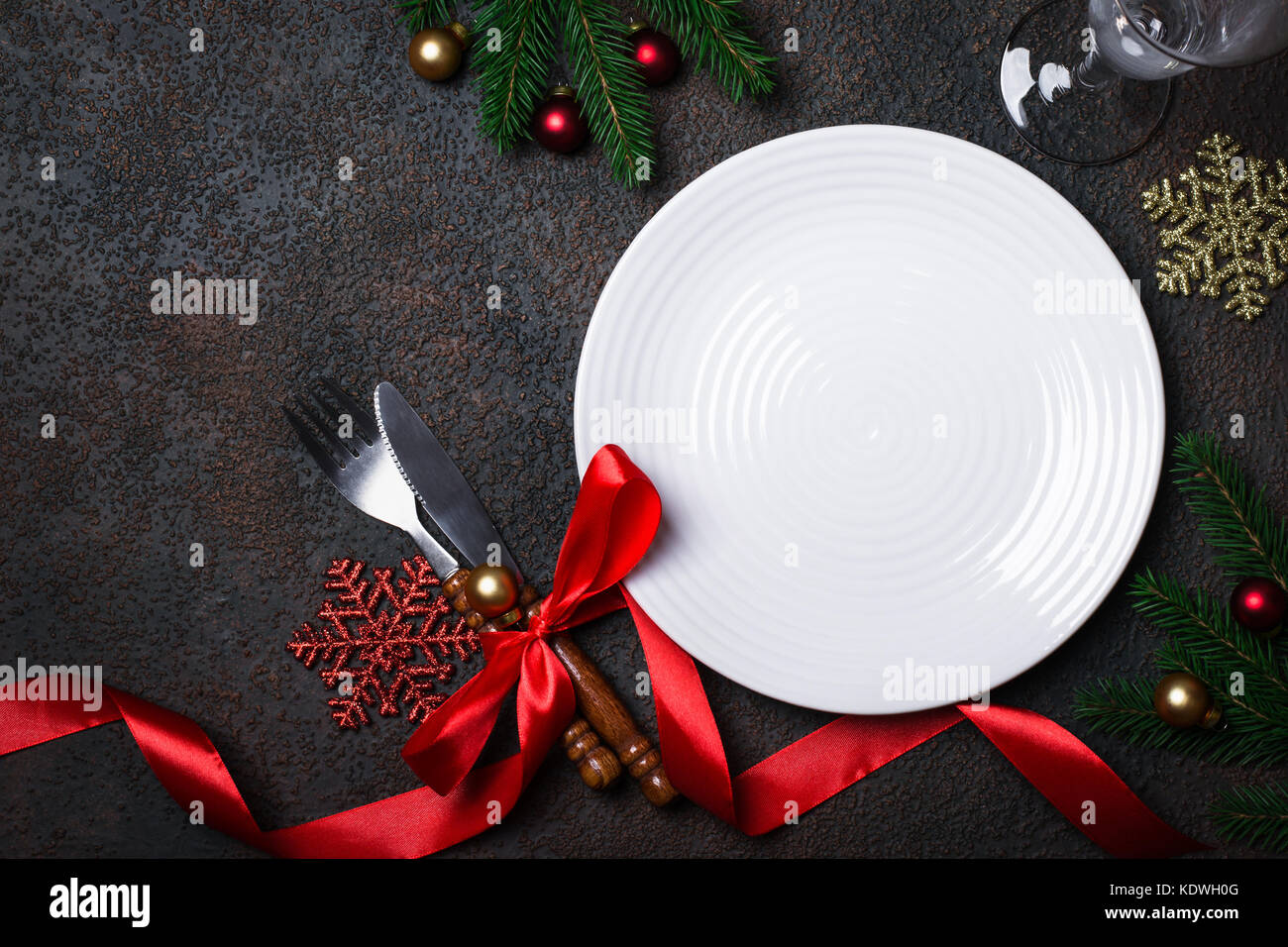 Christmas table setting with christmas decorations on a dark background Stock Photo