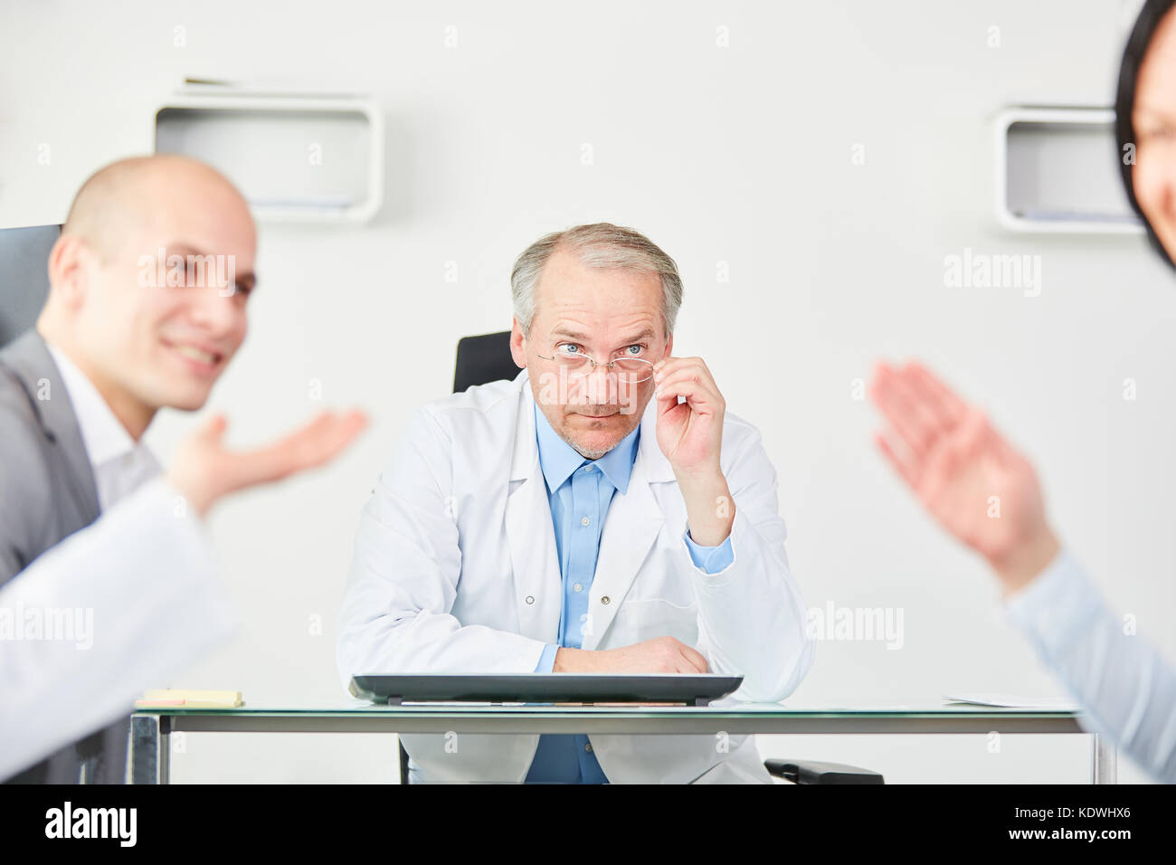 Senior as clinic physician chief executive planning in meeting with staff Stock Photo