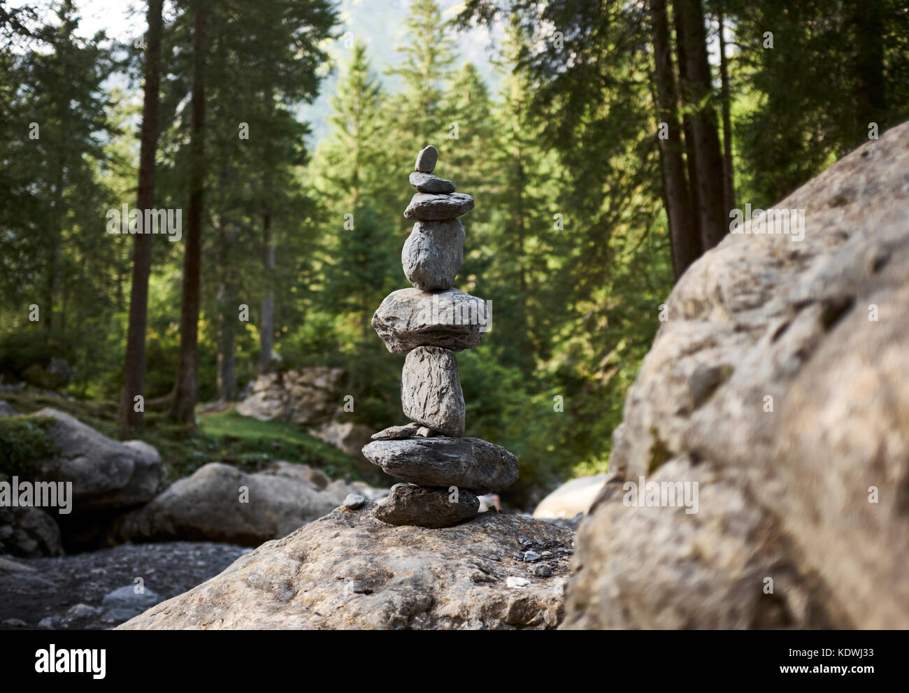 stacking stones in an alpine setting. Stock Photo