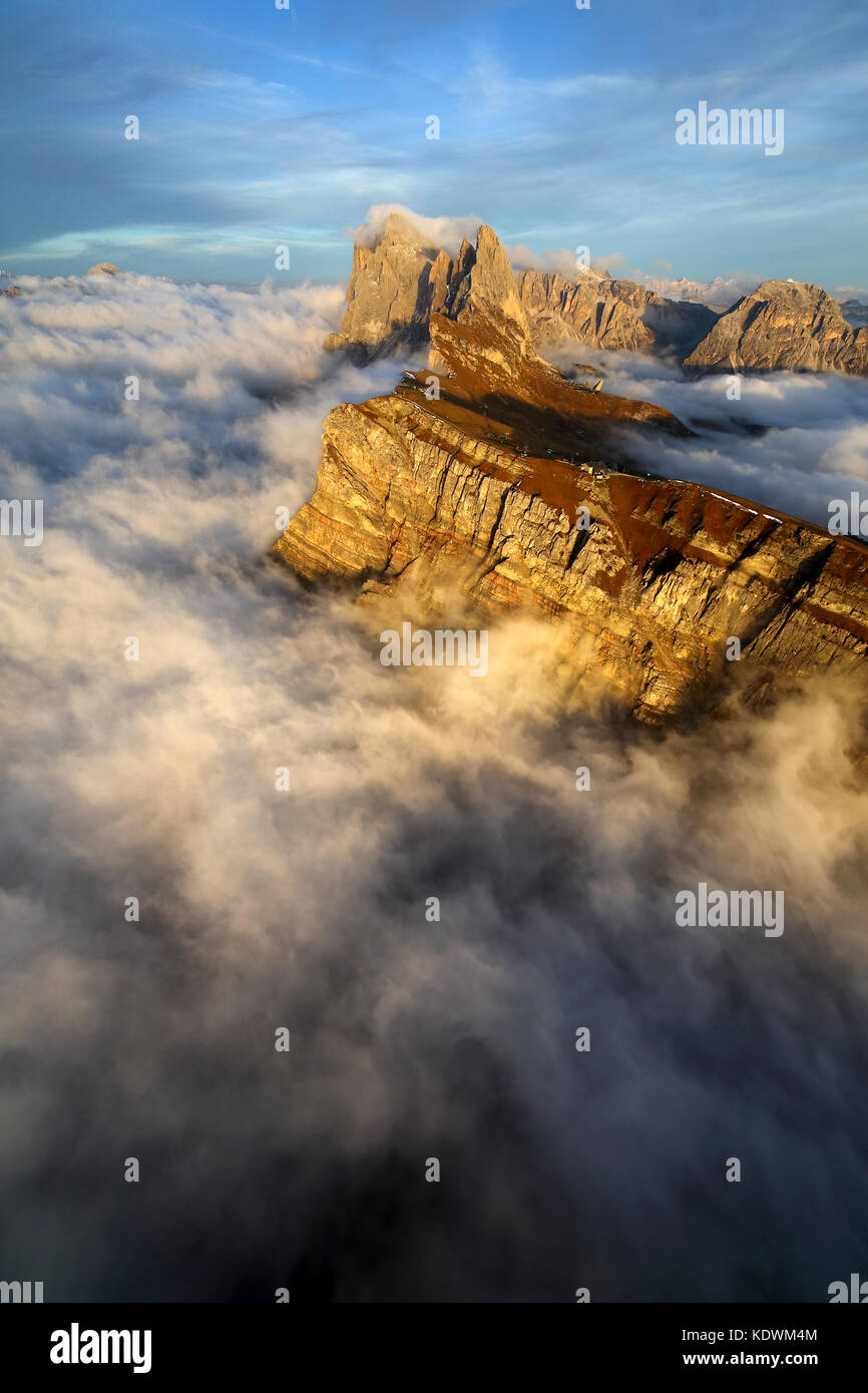 Aerial shot from Seceda of Odle surrounded by clouds at sunset. Dolomites Val Funes Trentino Alto Adige South Tyrol Italy Europe Stock Photo