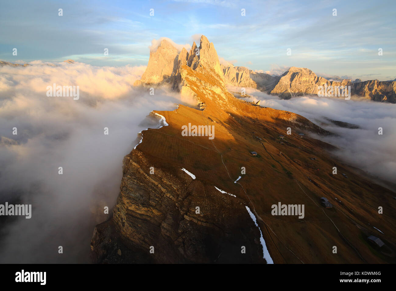 Aerial shot from Seceda of Odle surrounded by clouds at sunset. Dolomites Val Funes Trentino Alto Adige South Tyrol Italy Europe Stock Photo