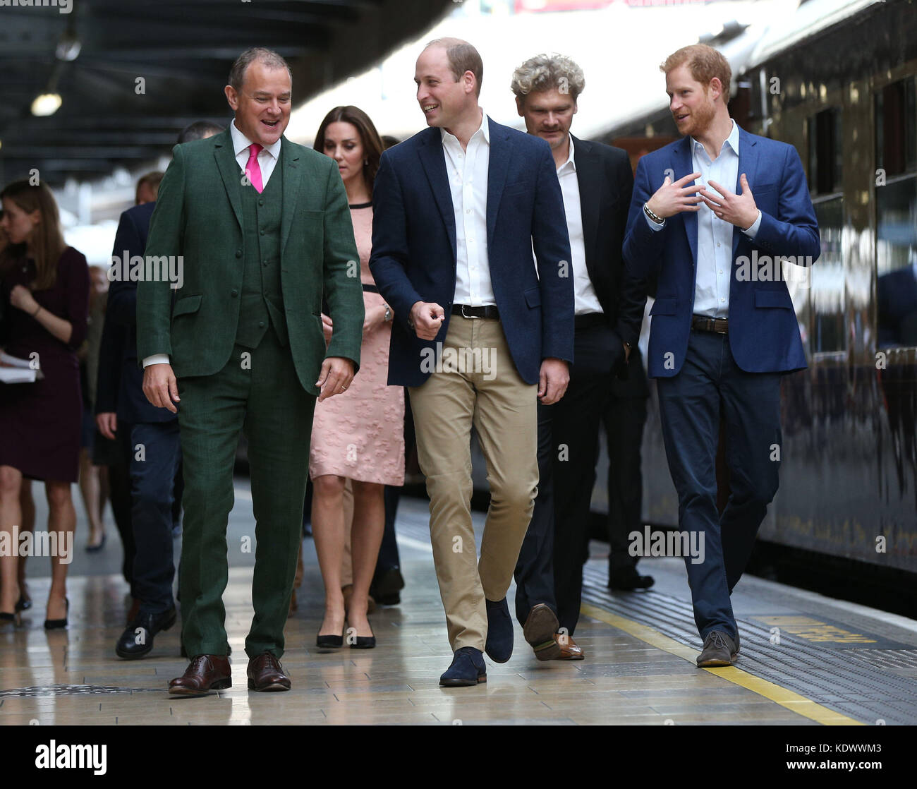Actor Hugh Bonneville (left) walks with the Duke and Duchess of Cambridge, Simon Farnaby and Prince Harry as the arrive at Paddington Station in London, to join children from the charities they support and meet the cast and crew from the forthcoming film Paddington 2. Stock Photo