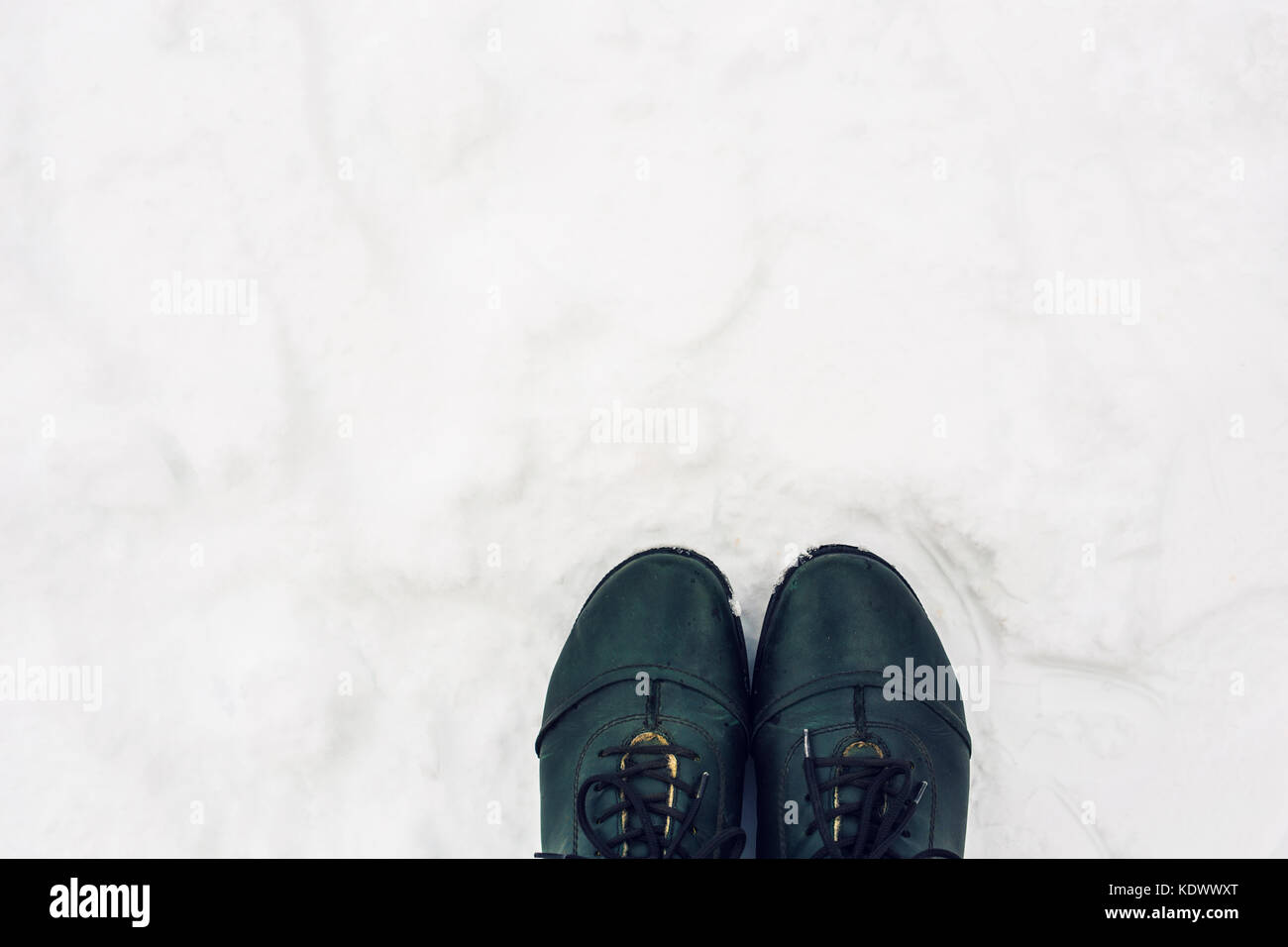 winter shoes in snow, closeup top view Stock Photo Alamy