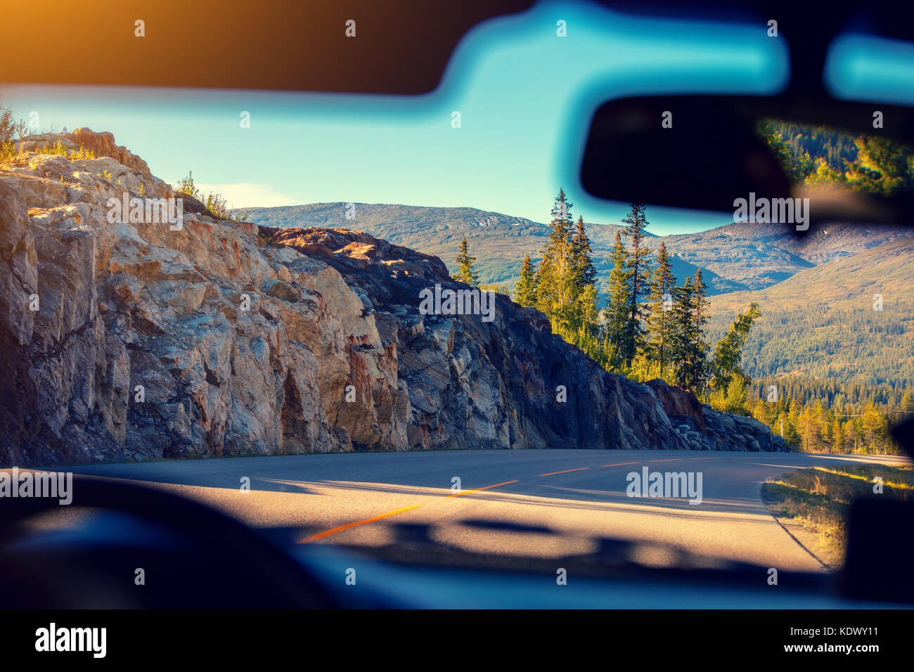 Driving a car on the mountain road. View from the windscreen. Nature of ...