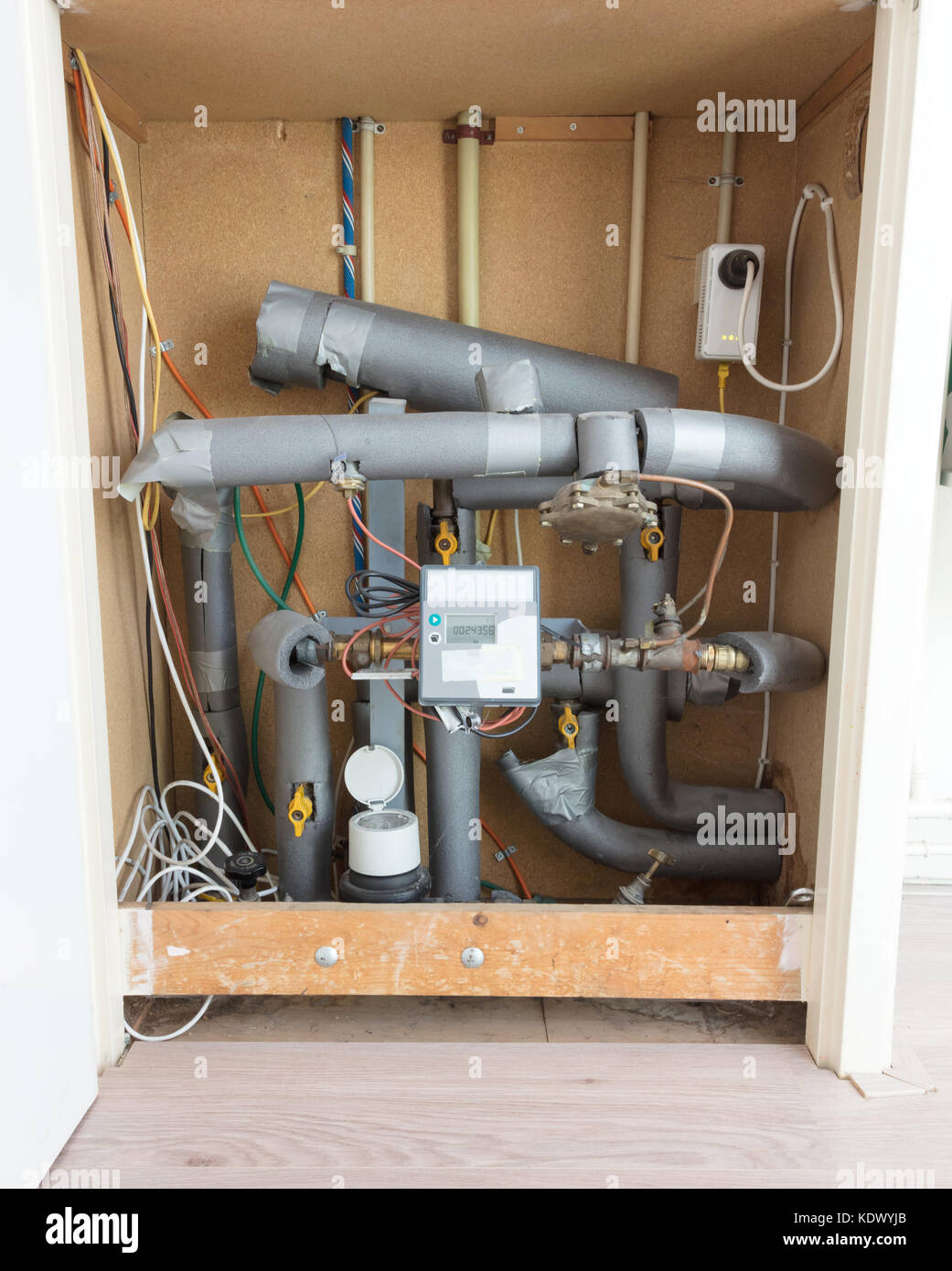 Meter and connection on city block heating in a dutch house Stock Photo