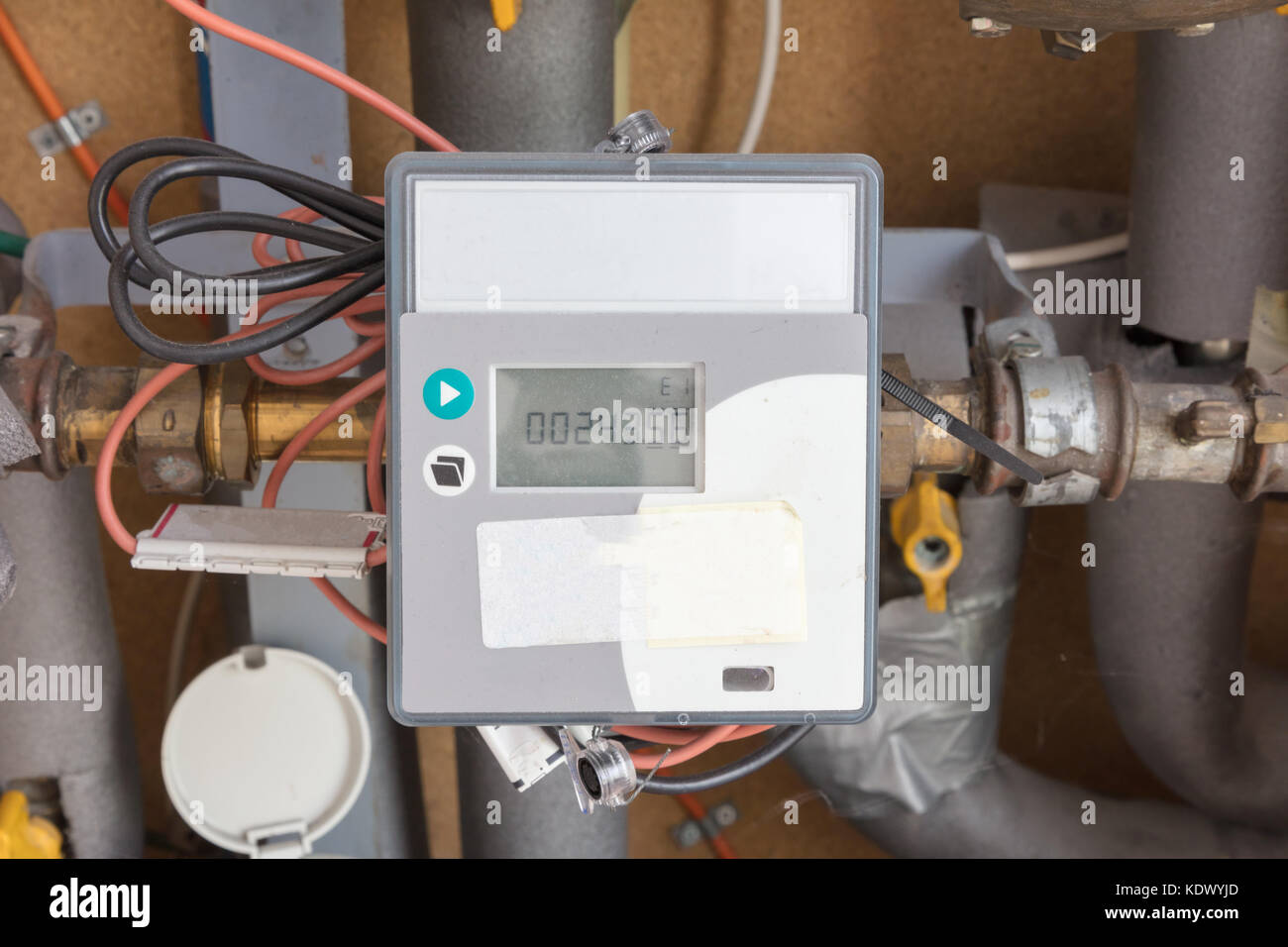 Meter and connection on city block heating in a dutch house Stock Photo