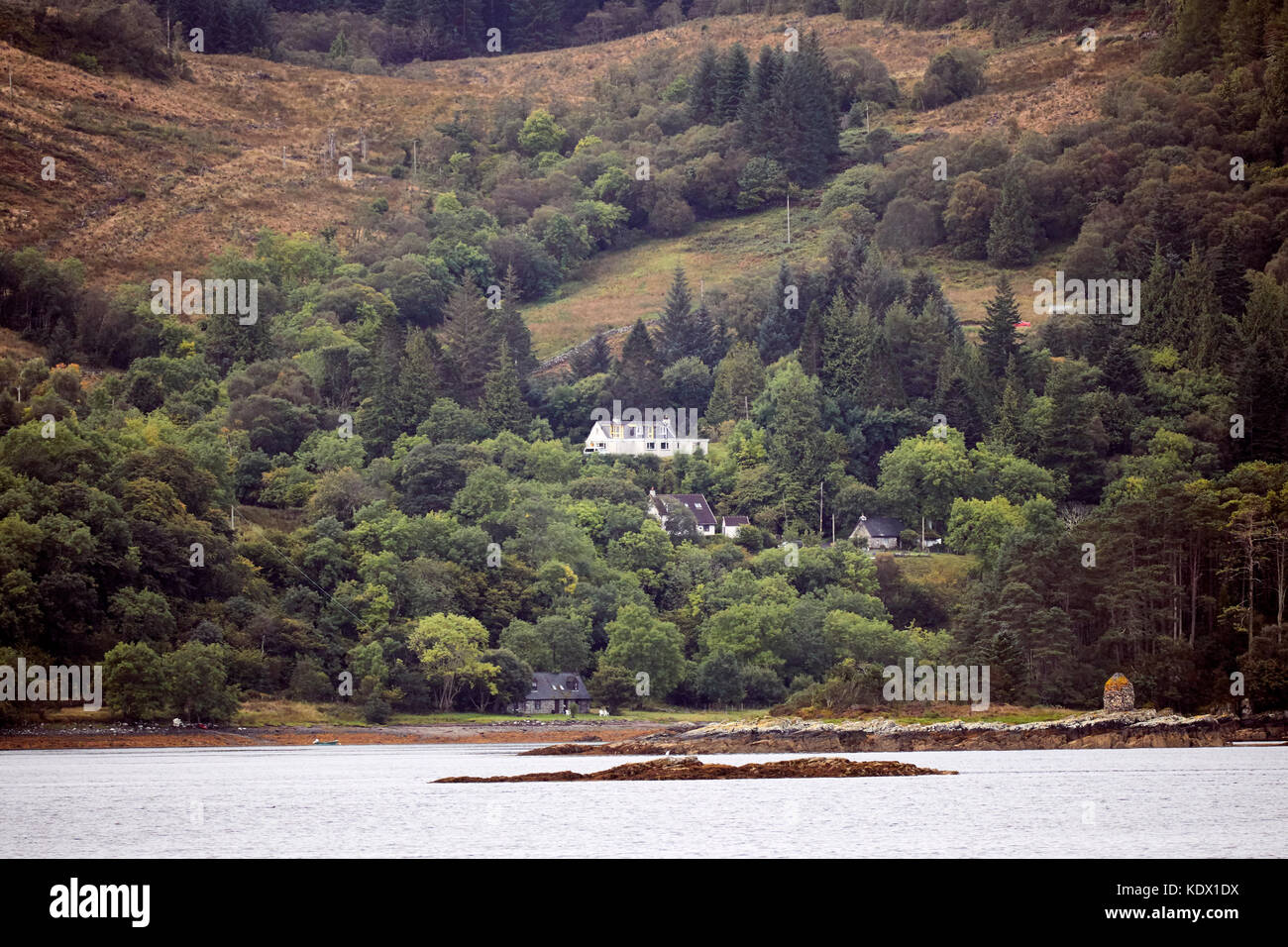 Due South across Loch Carron to hamlet and Creag an Duilisg behind. From Clachan at Ardaneaskan Stock Photo