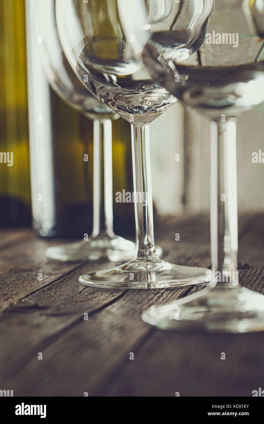 https://c8.alamy.com/comp/KDX1EY/wine-empty-wine-glass-in-wine-cellar-old-white-wine-on-woodarranged-KDX1EY.jpg