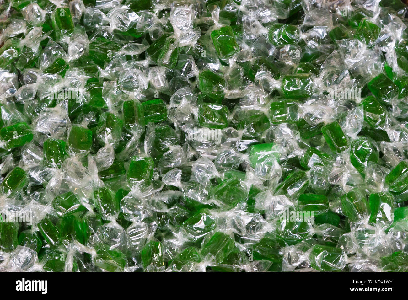 group of green mint candies wrapped in transparent plastic Stock Photo Alamy