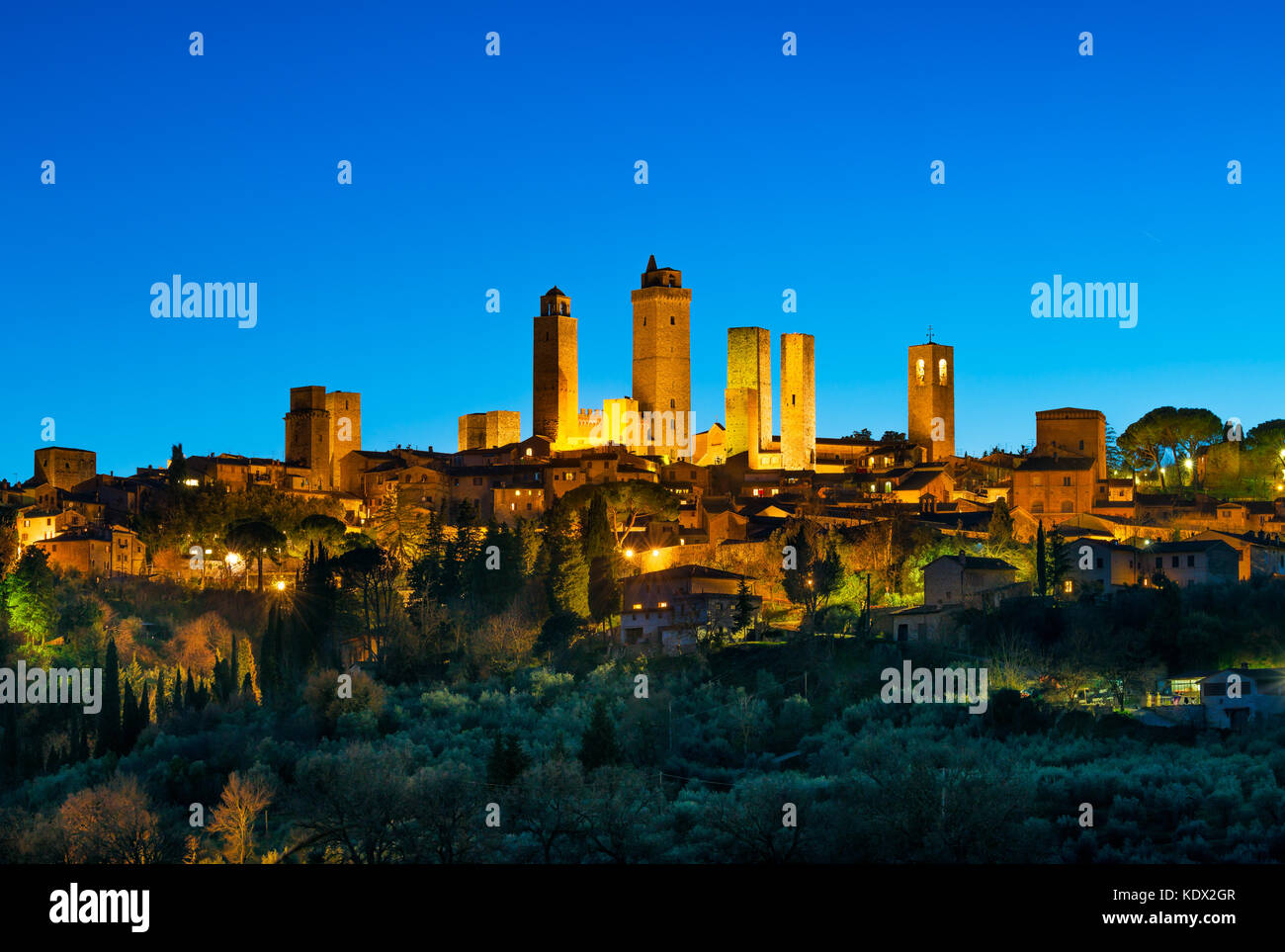 San Gimignano Town Skyline And Medieval Towers Sunset In Blue Hour Italian Olive Trees In