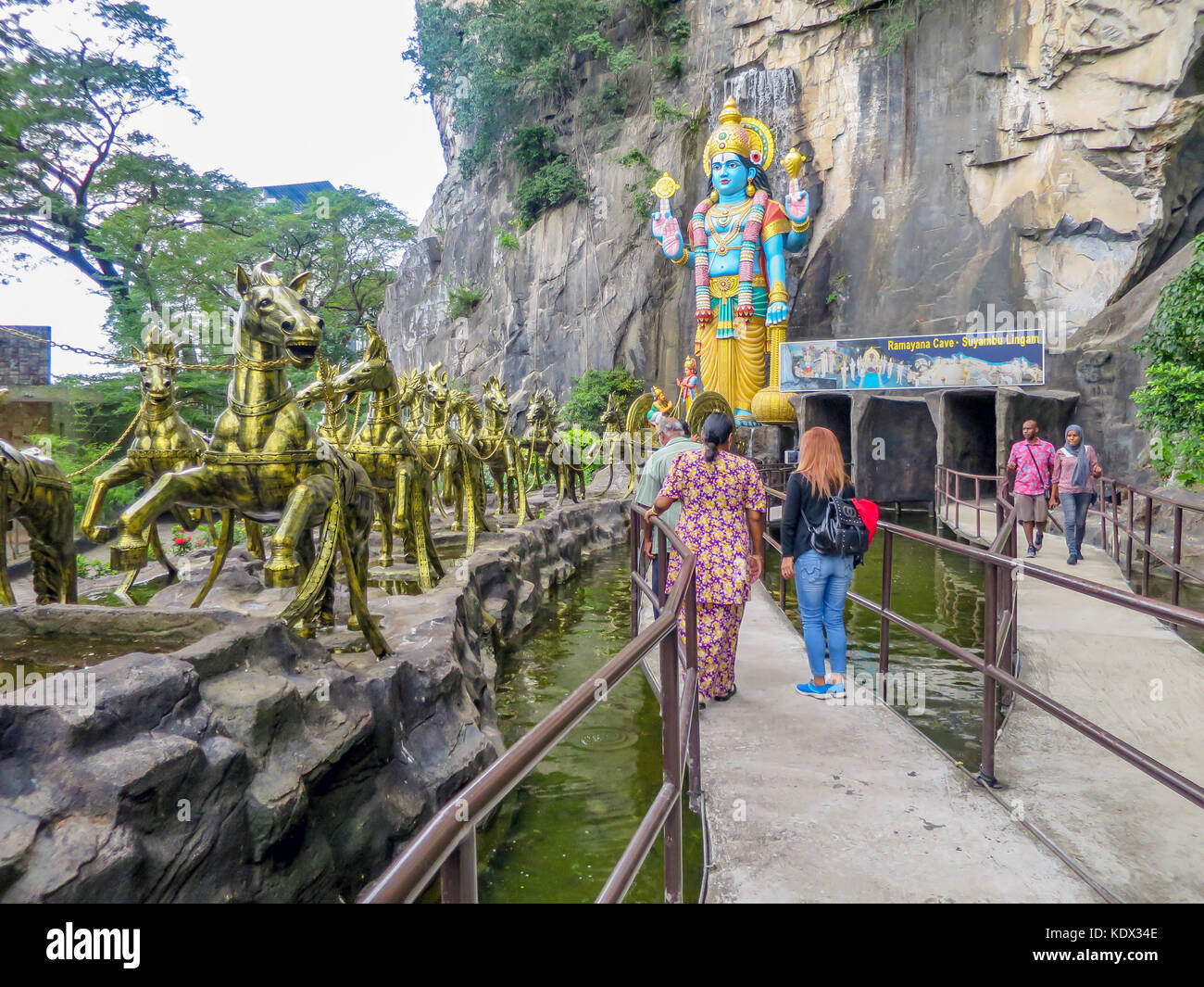 Ramayana Cave at Batu Cave Complex - bronze horses pull a chariot containing the Hindu God Vishnu, Gombek, Selangor, Malaysia. Stock Photo