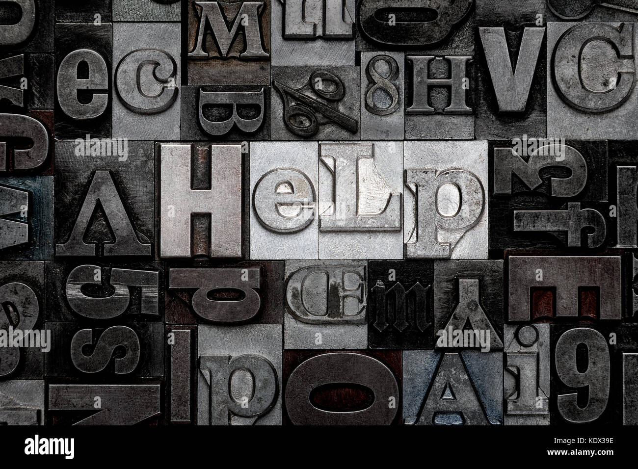 The word Help made from old metal letterpress letters Stock Photo