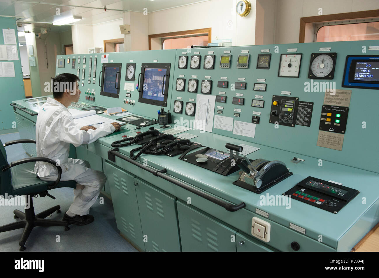 Ship's engineering officer in engine control room Stock Photo Alamy