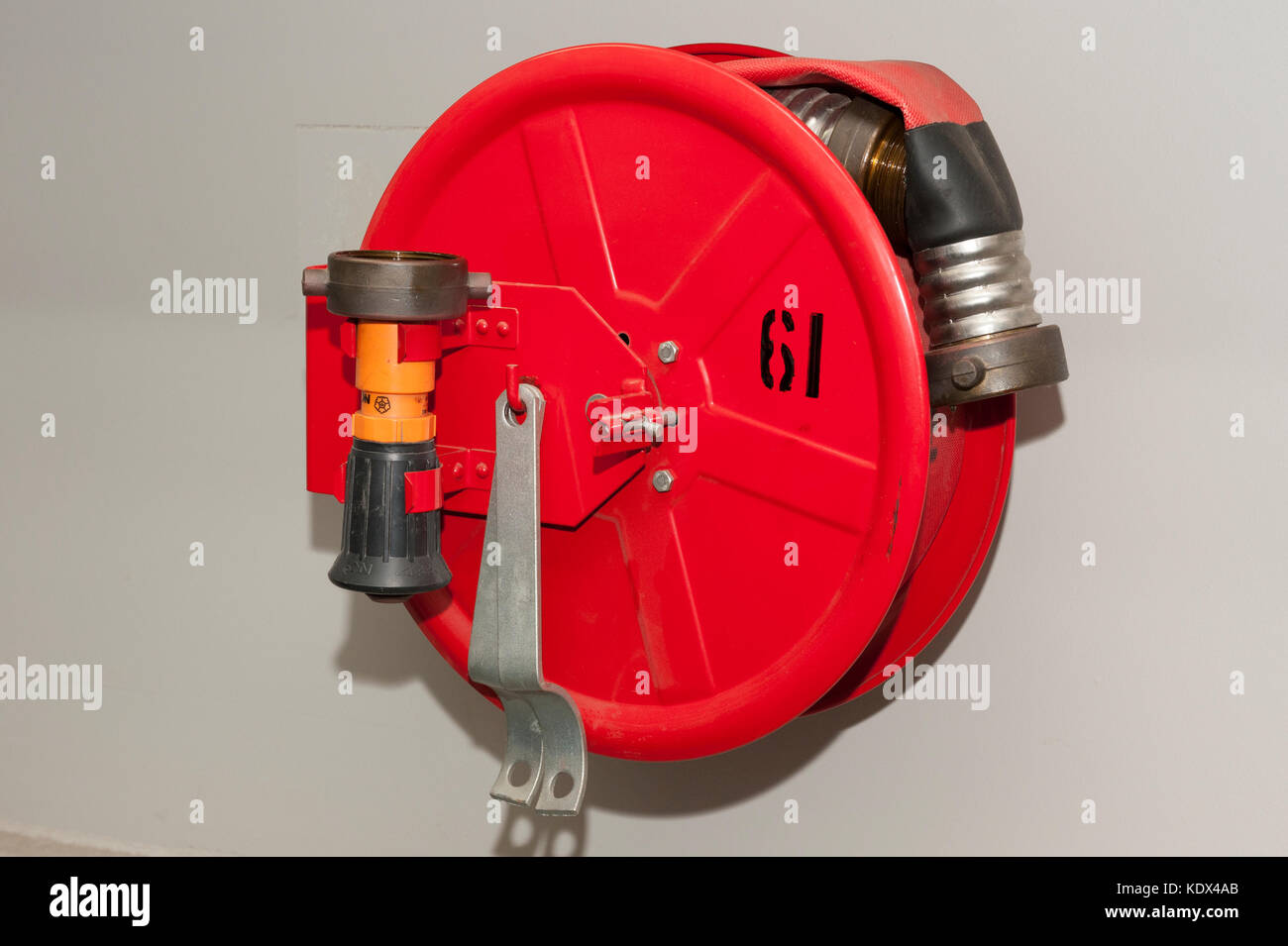 Fire hose reel on a container ship Stock Photo