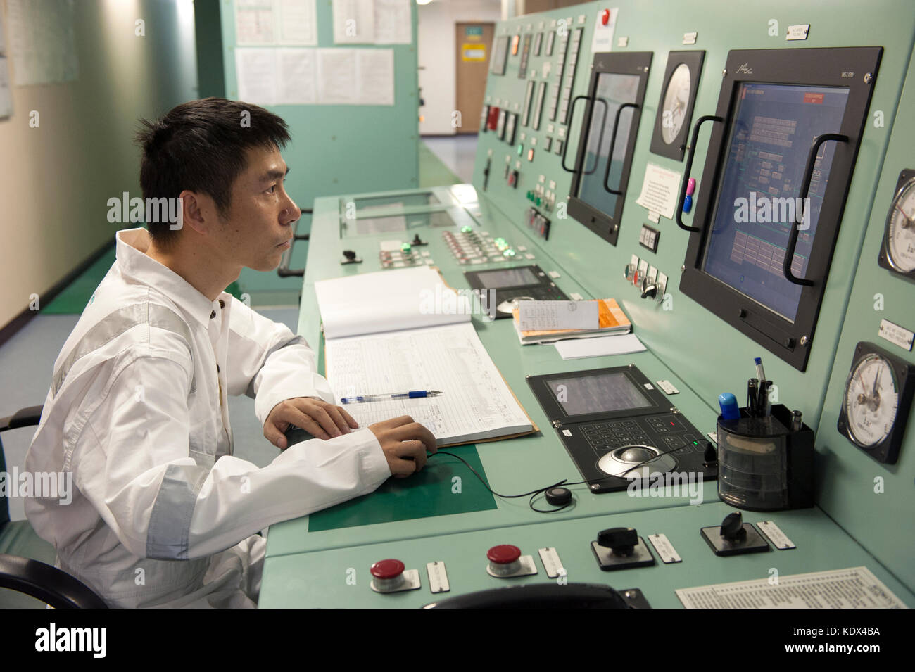Ship's engineering officer in engine control room Stock Photo Alamy