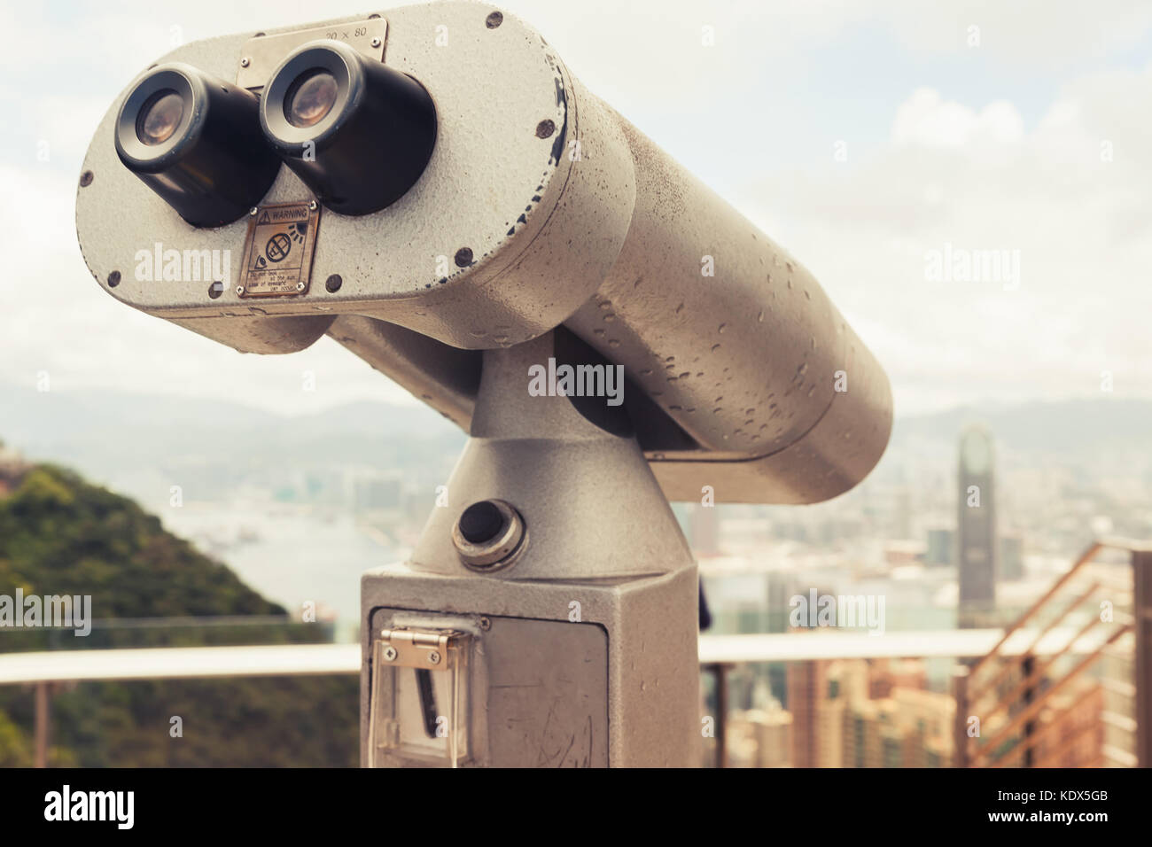 Tourist telescope for Hong Kong city observation from Victoria Peak viewpoint, vintage tonal correction, retro filter effect Stock Photo