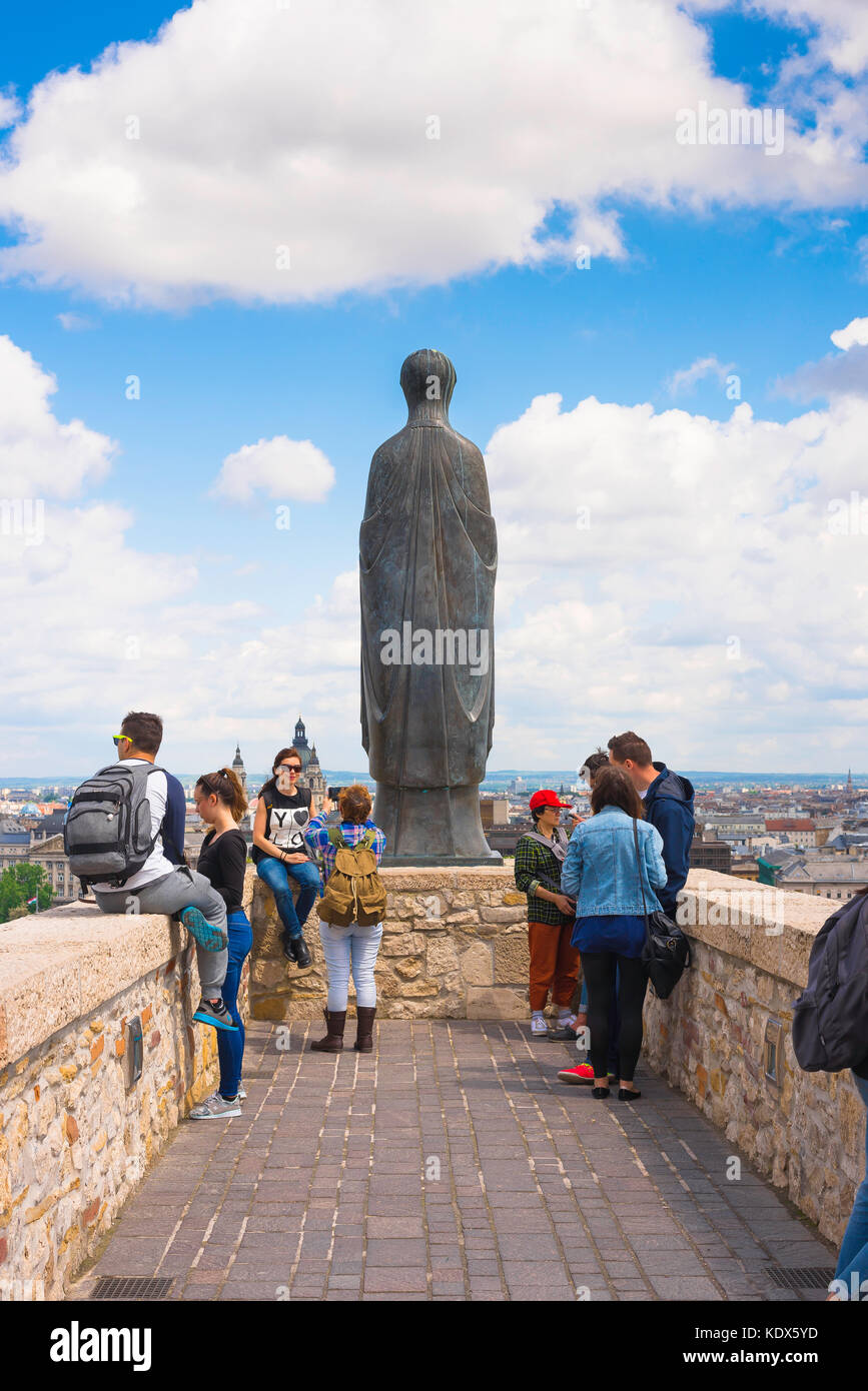 Budapest Royal Palace, tourists visiting the Royal Palace stand on a rampart overlooking the city of Budapest below, Hungary. Stock Photo