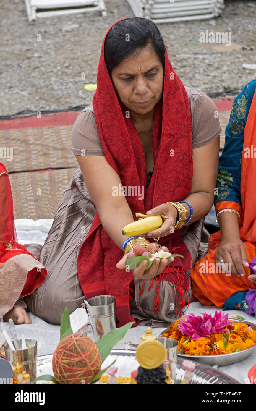 Portrait of a Guyanese Hindu woman in solemn prayer at the Lakshmi Hawan services at the Diwali Motorcade in Richmond Hills, Queens, New York. Stock Photo