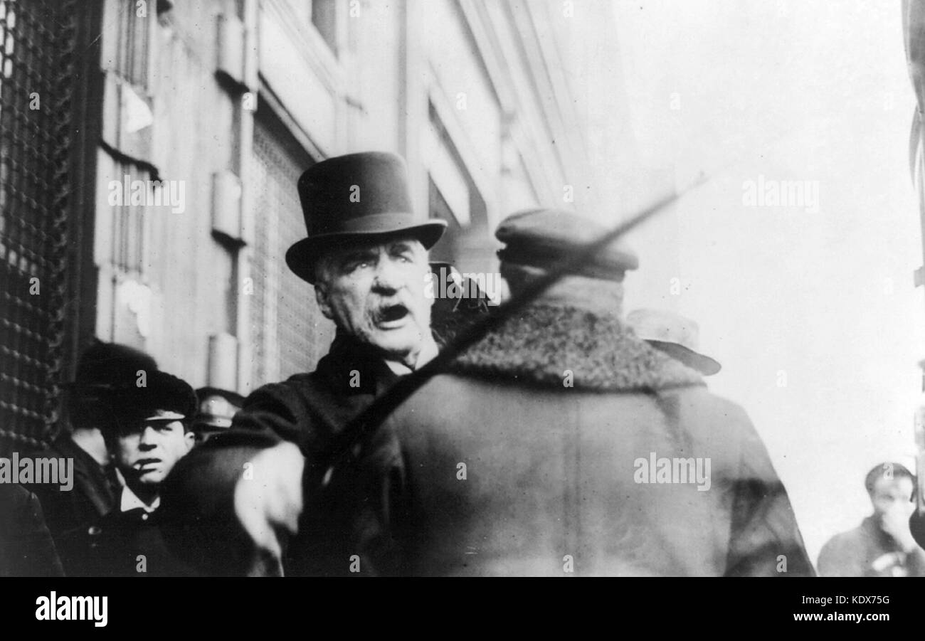 John Pierpont Morgan, J. P. Morgan striking photographer with cane, American financier and banker who dominated corporate finance and industrial consolidation in late 19th and early 20th Century in the United States. Date Created/Published: c1910 May 11. Medium: 1 photographic print. Reproduction Number: LC-USZ62-20579 (b&w film copy neg.) LC-USZ62-29530 (b&w film copy neg.) Rights Advisory: No known restrictions on publication. Call Number: BIOG FILE - Morgan, John Pierpont, 1837-1913 <item> [P&P] Repository: Library of Congress Prints and Stock Photo