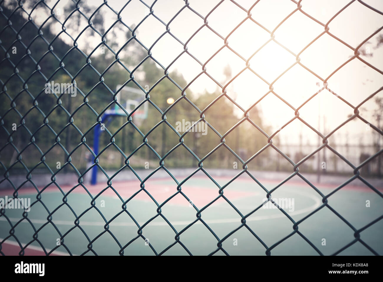 Basketball court with fence Stock Photo - Alamy