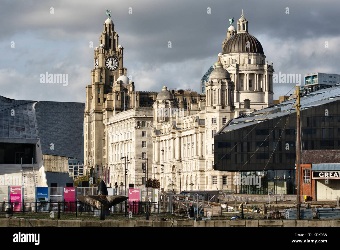 Liverpool, UK. The Port of Liverpool Building at Pier Head, with part of the new RIBA North building, and the Royal Liver Building in the background Stock Photo