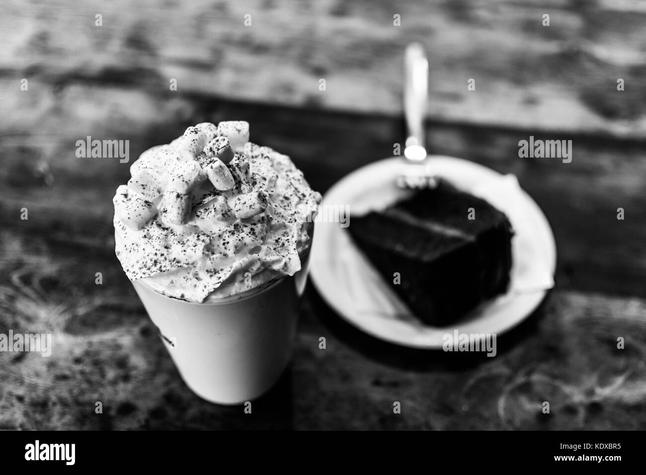 a tasty hot chocolate and cake in a local cafe Stock Photo