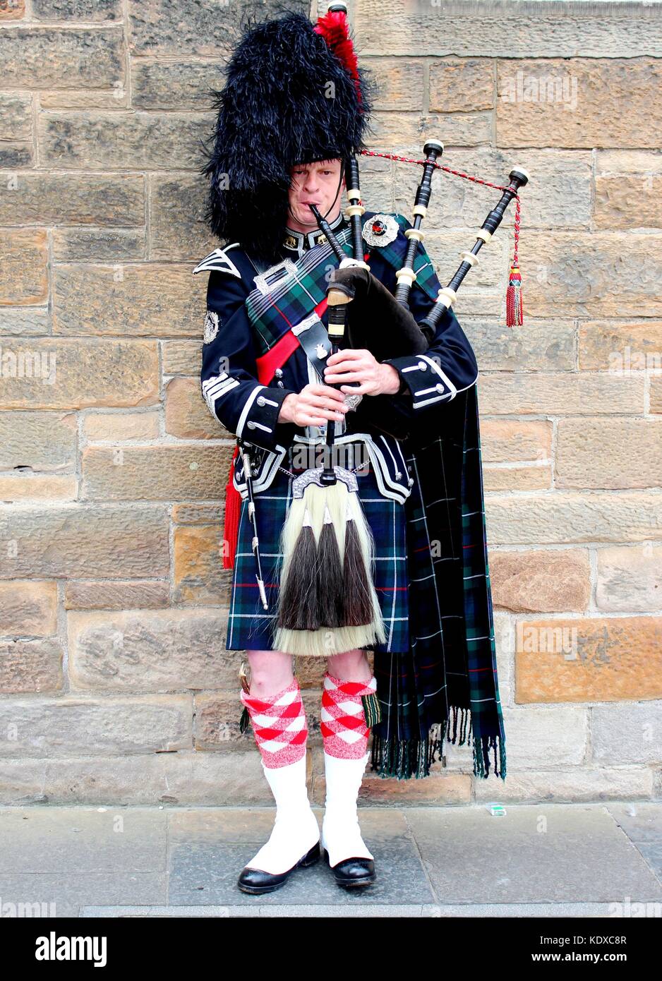 Part of the Edinburgh experience is the sound of bagpipes as you stroll the city streets Stock