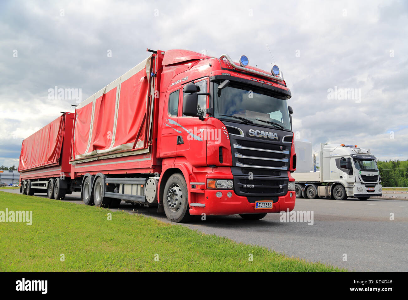 White and red Scania R560 semi trailer truck Toten Transport Oy transports  goods along motorway with slow traffic. Salo, Finland. June 12, 2020 Stock  Photo - Alamy