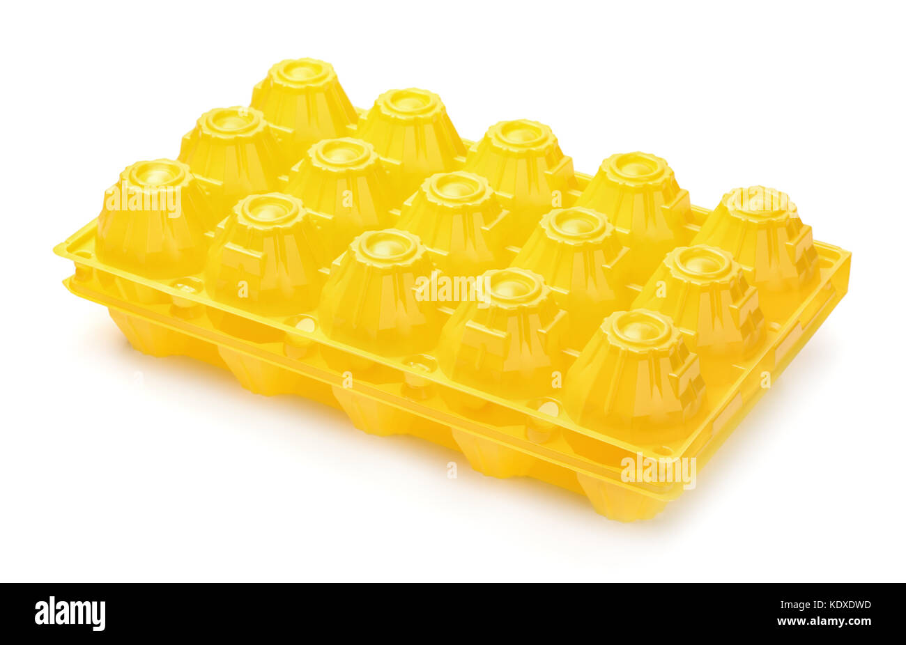 Yellow plastic eggs box isolated on white Stock Photo