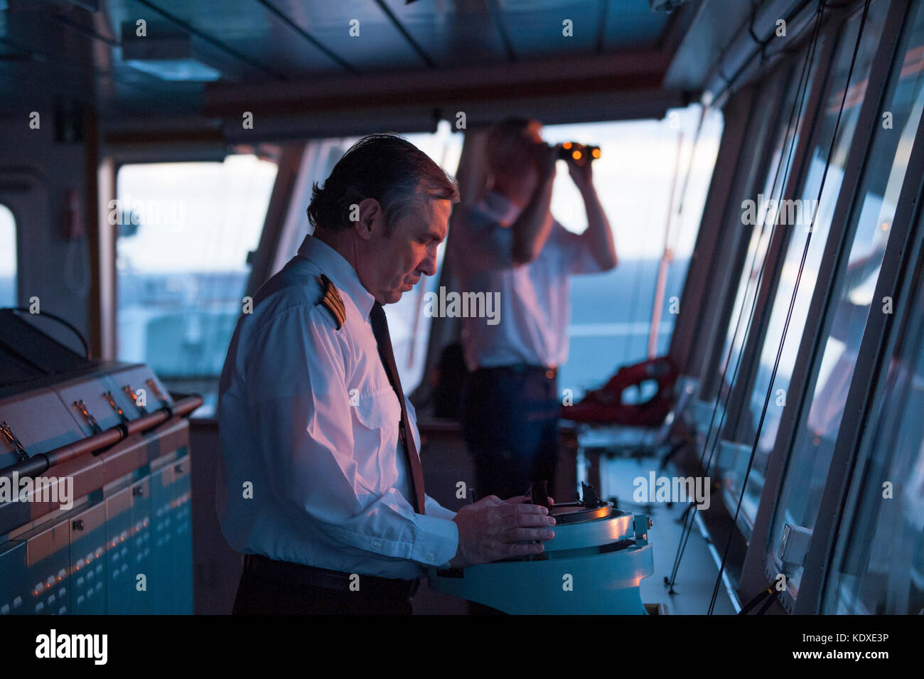 A ship's captain on the bridge of a merchant ship Stock Photo Alamy