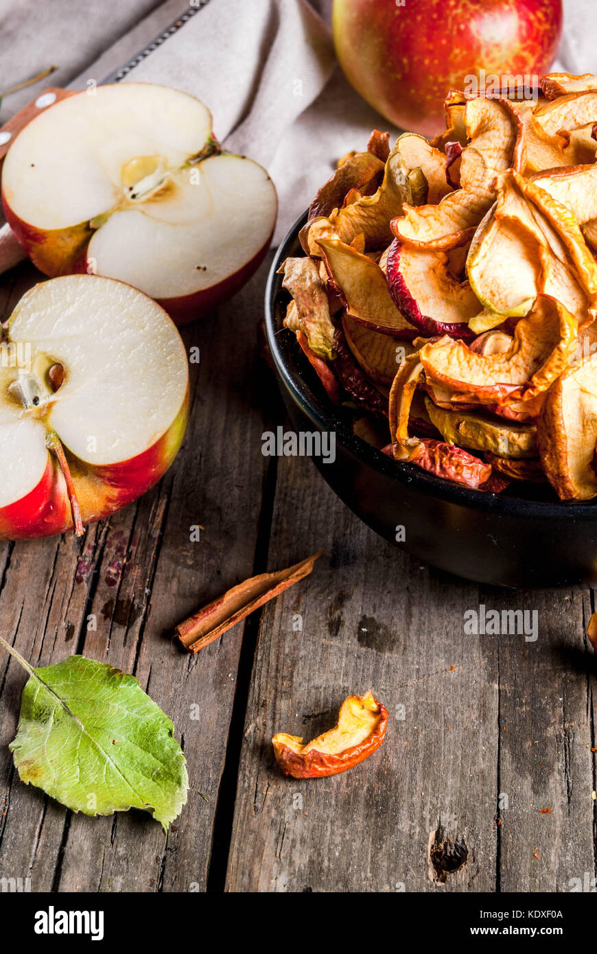 Homemade sundried organic apple slices, crispy apple chips, on an old