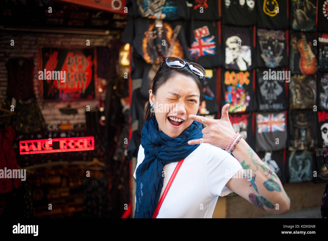 Tattoed girl smiling at camera Stock Photo